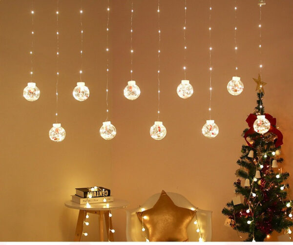Karácsonyi 10 darabos gömb alakú fényfüggöny 3 méteres, sárga színű, télapó figurával
